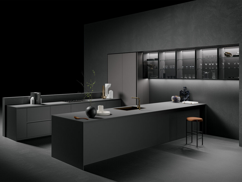 Base units CX 11 and worktop in Fenix nero ingo with curved groove. Tall units CX 11 in oxidise metal lacquered acciaio. Vidro wall units CX 19 with matt lacquered structure nero and smoked glass.